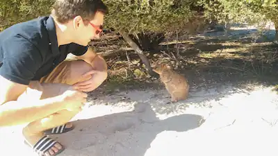 me standing next to a quokka